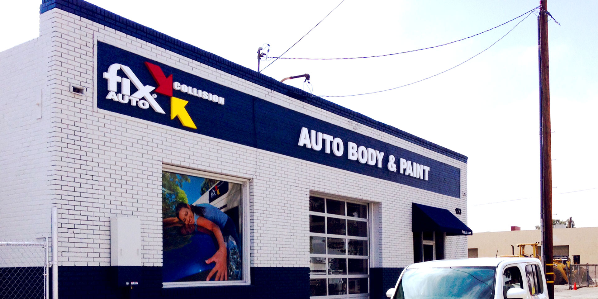 Fix Auto Orange Auto Body Shop Sign and Building Exterior