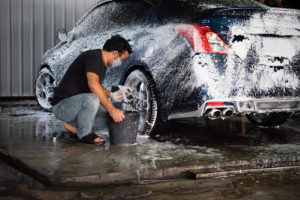 a man cleaning a car