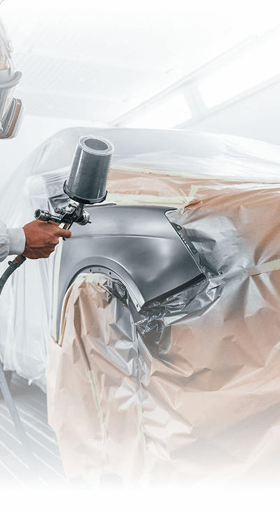 Dent repair and paint preparation at a certified collision repair center
