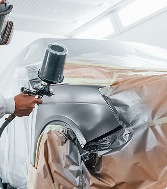 Dent repair and paint preparation at a certified collision repair center